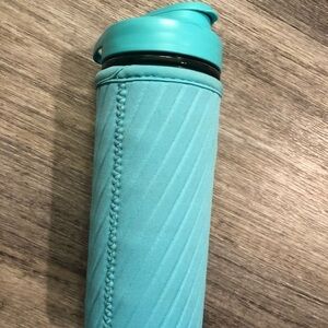Mason tops glass water bottle with coozy